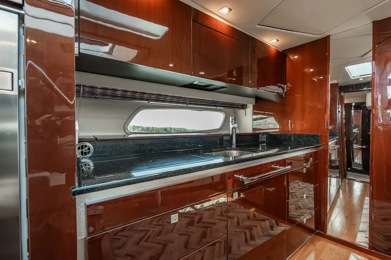 Hav-n Fun Yacht Photos Pics Luxurious kitchen interior of 2009 Sea Ray 470 Sundancer yacht with sleek cabinetry.