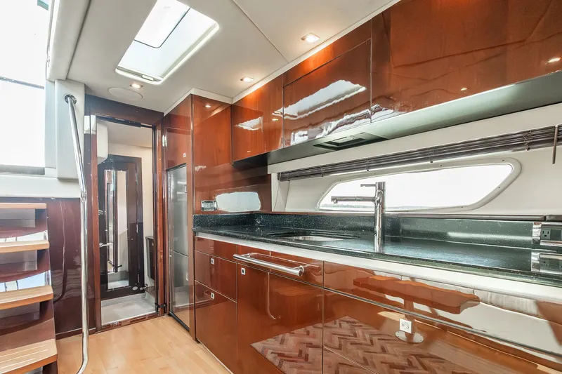 Hav-n Fun Yacht Photos Pics Luxurious 2009 Sea Ray 470 Sundancer yacht interior with modern kitchen and sleek cabinetry.