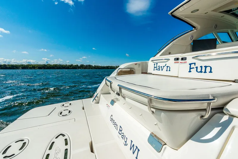 Hav-n Fun Yacht Photos Pics 2009 Sea Ray 470 Sundancer yacht on water, clear sky, "Hav'n Fun" text visible.