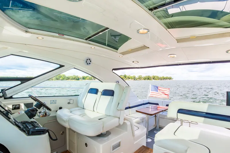 Hav-n Fun Yacht Photos Pics Interior of 2009 Sea Ray 470 Sundancer yacht with lake view and American flag.