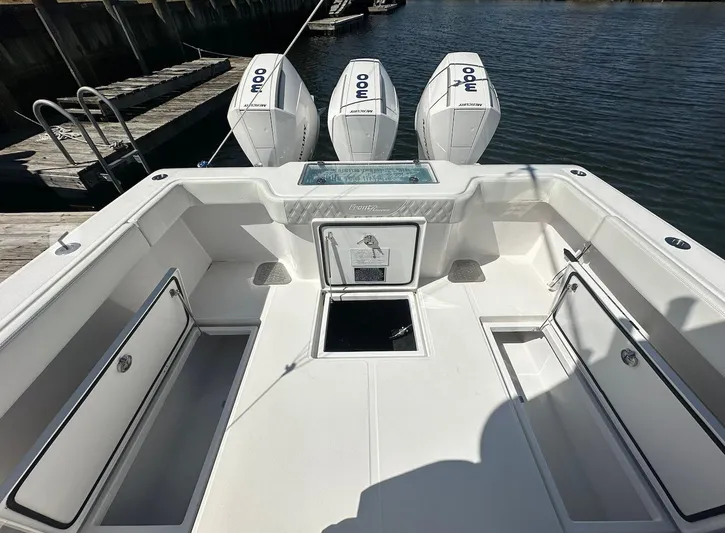Avery Ann Yacht Photos Pics 2023 Front Runner 33 Center Console boat with triple outboard engines docked by the water.