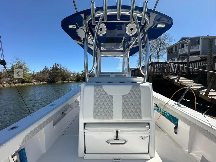 Avery Ann Yacht Photos Pics 2023 Front Runner 33 Center Console boat docked by a wooden pier.