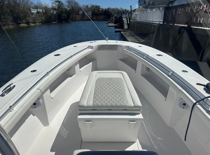 Avery Ann Yacht Photos Pics 2023 Front Runner 33 Center Console boat on a calm river, featuring sleek seating and storage.