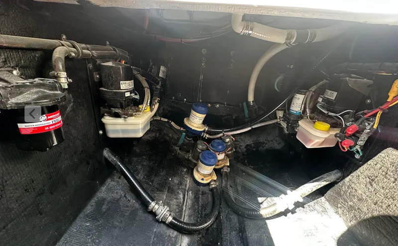 Avery Ann Yacht Photos Pics 2023 Front Runner 33 Center Console boat engine compartment with various mechanical components.
