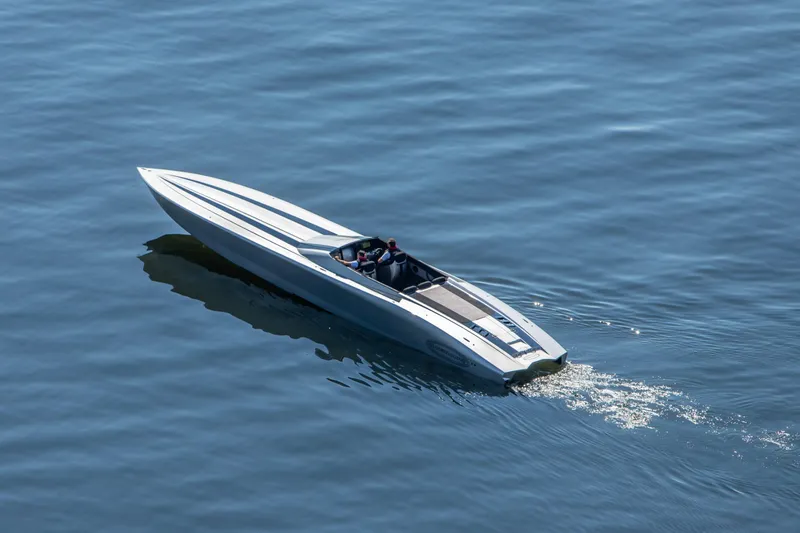  Yacht Photos Pics 2020 Outerlimits SL-50 speedboat cruising on calm blue water.