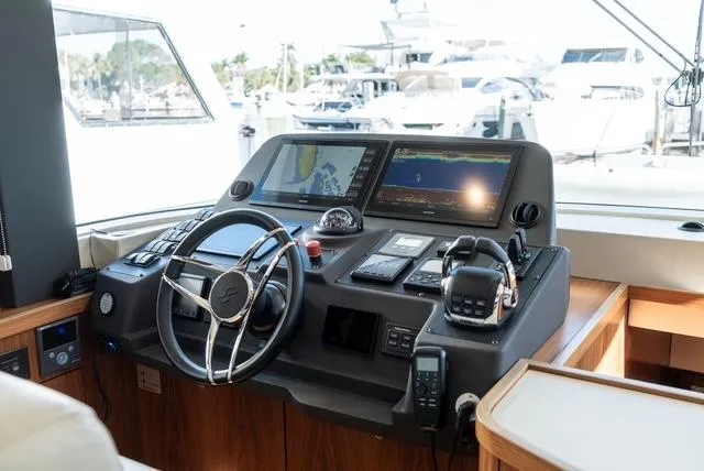 Freedom Yacht Photos Pics Helm station of 2022 Sirena 58 Flybridge yacht with advanced navigation systems.