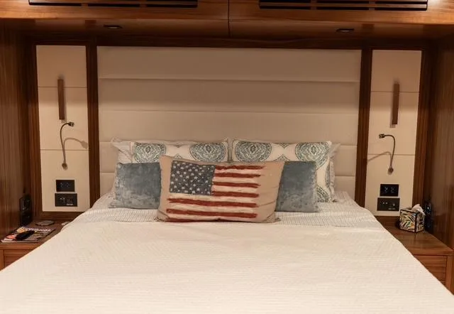 Freedom Yacht Photos Pics Luxurious bedroom in 2022 Sirena 58 Flybridge yacht with American flag pillow.