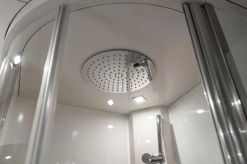 Freedom Yacht Photos Pics Luxurious shower in 2022 Sirena 58 Flybridge yacht, featuring modern fixtures and sleek design.