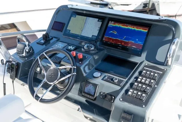 Freedom Yacht Photos Pics Control panel of 2022 Sirena 58 Flybridge yacht with navigation and communication systems.