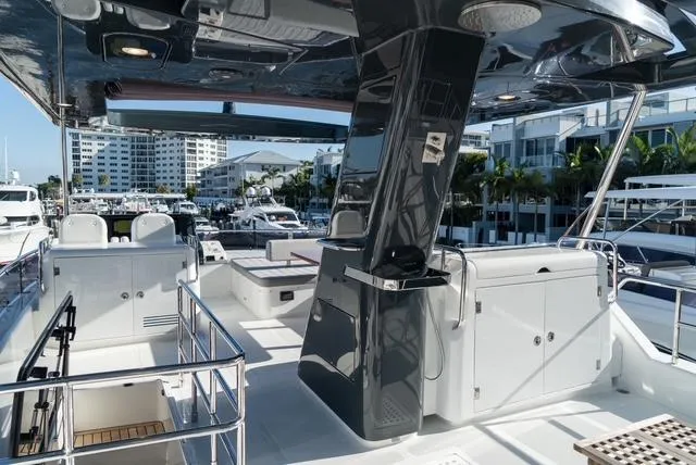 Freedom Yacht Photos Pics 2022 Sirena 58 Flybridge yacht with modern deck and marina view.