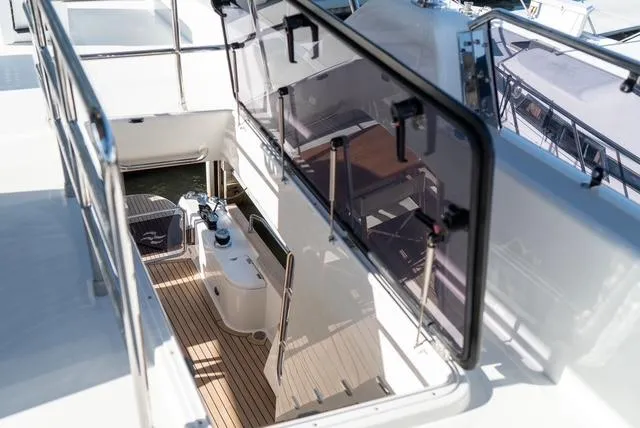 Freedom Yacht Photos Pics 2022 Sirena 58 Flybridge yacht with sleek deck and modern design.