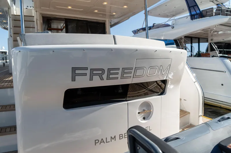Freedom Yacht Photos Pics 2022 Sirena 58 Flybridge yacht named "Freedom" docked at a marina.