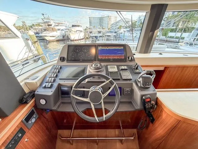 Freedom Yacht Photos Pics Helm of 2022 Sirena 58 Flybridge yacht with modern navigation equipment.