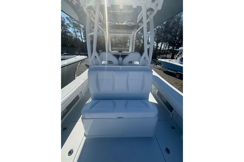  Yacht Photos Pics 2026 Yellowfin 36 Offshore boat interior with white seating and sleek design.