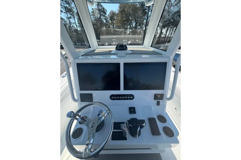  Yacht Photos Pics 2026 Yellowfin 36 Offshore boat console with dual screens and steering wheel.