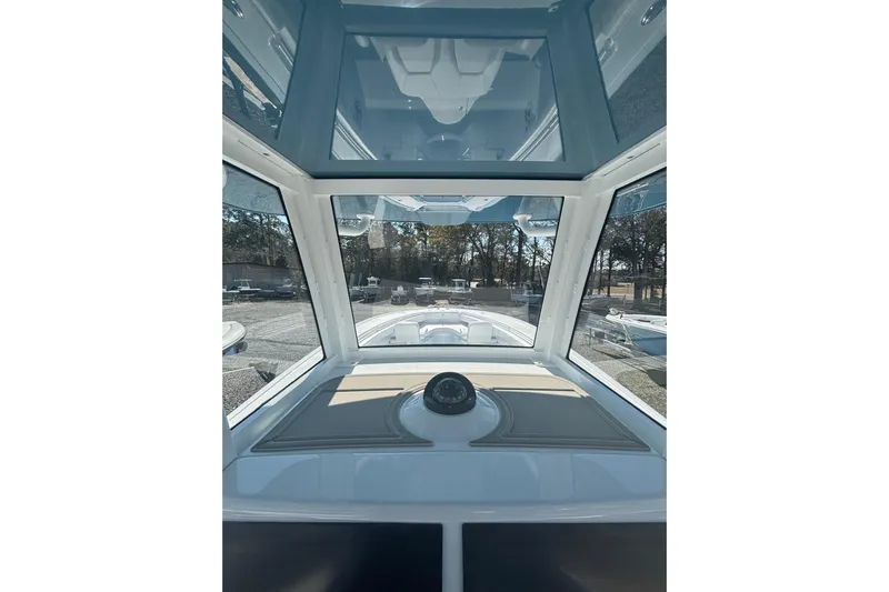  Yacht Photos Pics 2026 Yellowfin 36 Offshore boat interior with panoramic windows and compass.
