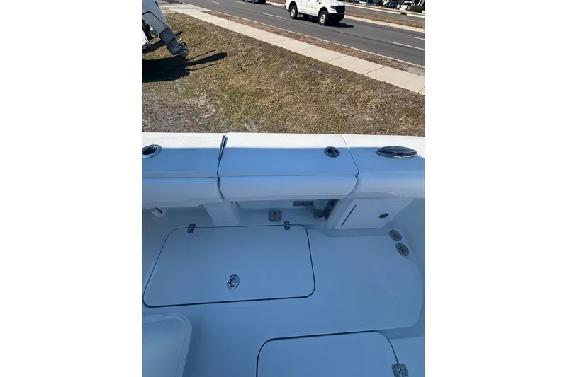  Yacht Photos Pics 2026 Yellowfin 36 Offshore boat interior with storage compartments and rod holders.