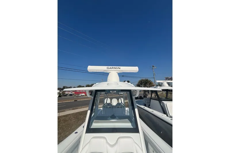  Yacht Photos Pics 2026 Yellowfin 36 Offshore boat with Garmin radar under clear blue sky.