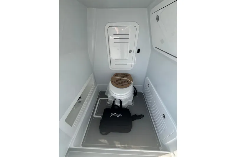  Yacht Photos Pics Interior of 2026 Yellowfin 36 Offshore boat, featuring a compact marine toilet.