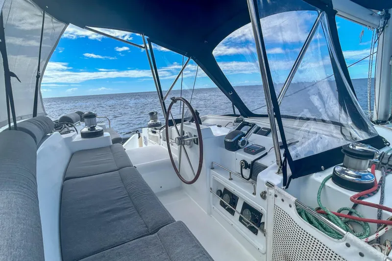 Sailifi Yacht Photos Pics Cockpit of 2007 Lagoon 440 catamaran with ocean view and blue sky.