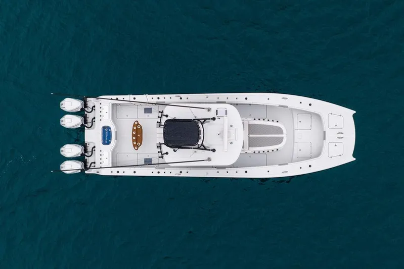Never Enough Yacht Photos Pics Top view of 2025 Freeman 38 boat on blue water.