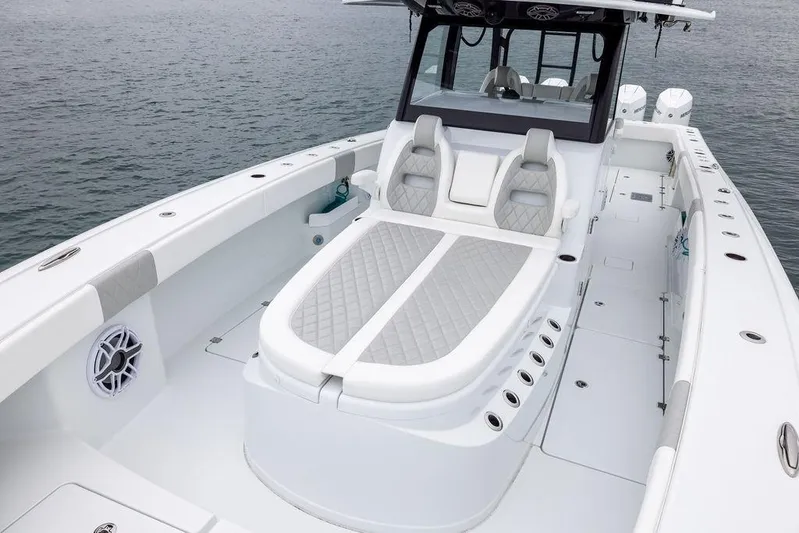 Never Enough Yacht Photos Pics 2025 Freeman 38 boat with luxurious seating on calm water.