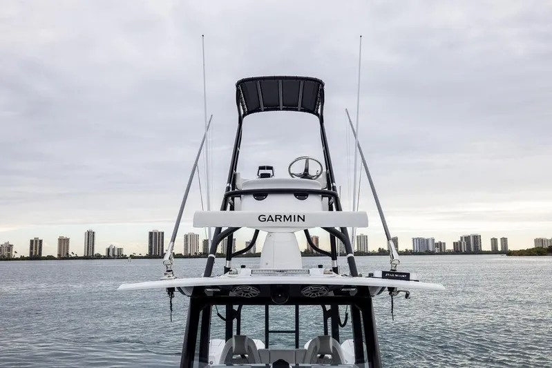Never Enough Yacht Photos Pics Freeman 38 boat with Garmin equipment, city skyline in background, 2025 model.
