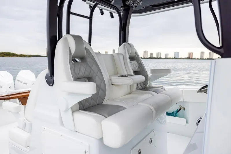 Never Enough Yacht Photos Pics Luxury seating on a 2025 Freeman 38 boat with ocean view.