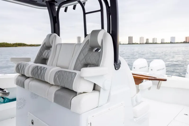 Never Enough Yacht Photos Pics Luxury seating on 2025 Freeman 38 boat with ocean view and city skyline.