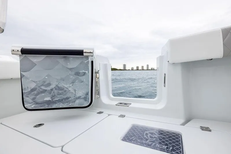 Never Enough Yacht Photos Pics Freeman 38 boat interior, 2025 model, with ocean view and city skyline.