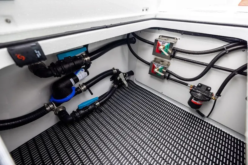Never Enough Yacht Photos Pics Freeman 38 (2025) boat compartment with wiring and control panels.