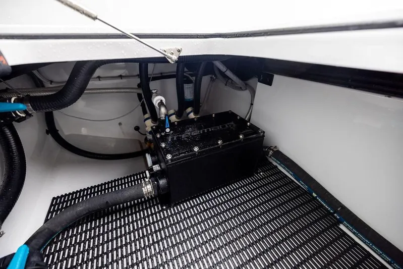 Never Enough Yacht Photos Pics Engine compartment of 2025 Freeman 38 boat with visible hoses and components.