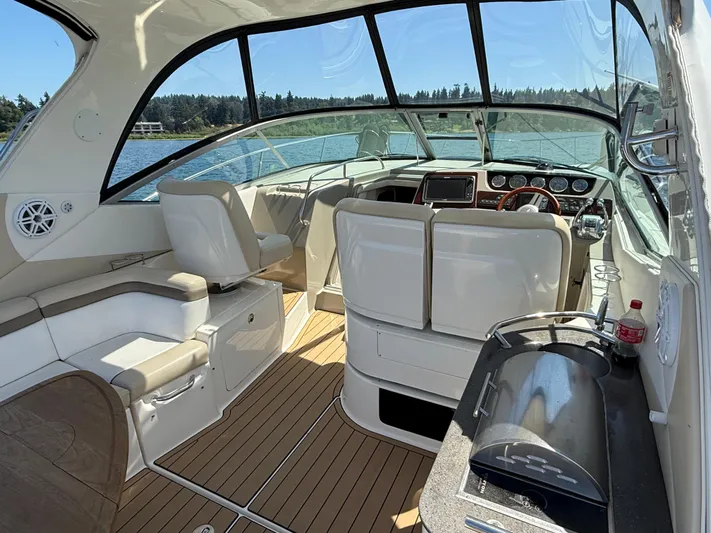  Yacht Photos Pics Interior of 2012 Sea Ray 370 Sundancer yacht with helm and seating area.