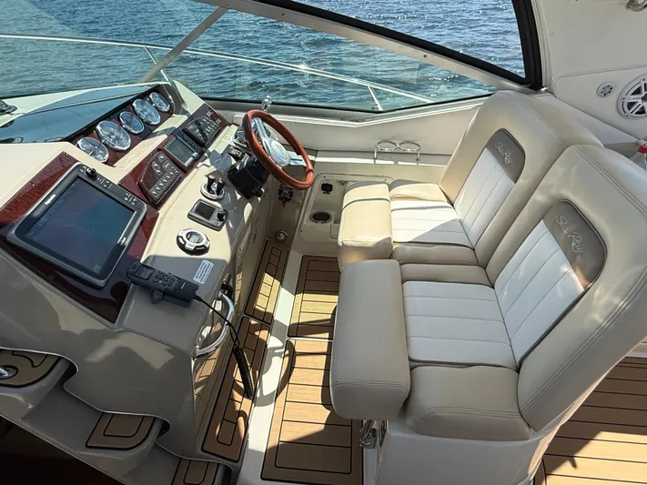  Yacht Photos Pics Helm of 2012 Sea Ray 370 Sundancer with dual seats and advanced navigation controls.