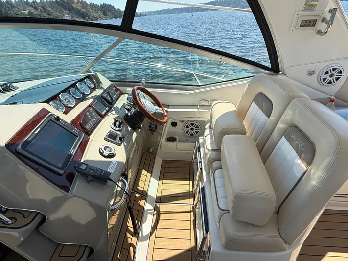  Yacht Photos Pics Interior of 2012 Sea Ray 370 Sundancer yacht with modern dashboard and leather seating.