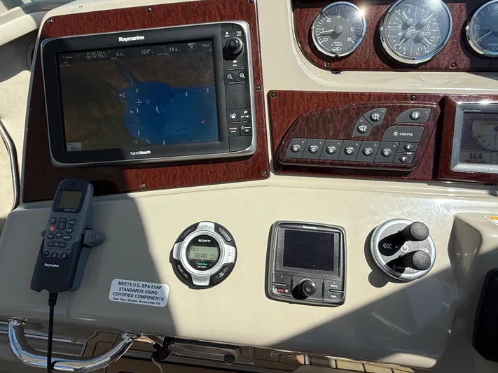  Yacht Photos Pics Control panel of a 2012 Sea Ray 370 Sundancer with navigation and communication equipment.