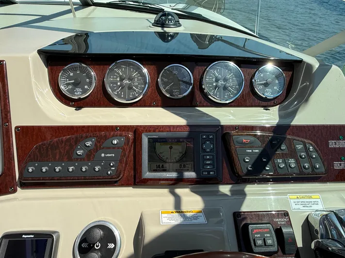  Yacht Photos Pics Dashboard of a 2012 Sea Ray 370 Sundancer boat with gauges and controls.