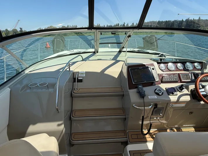  Yacht Photos Pics 2012 Sea Ray 370 Sundancer helm with navigation instruments and scenic water view.