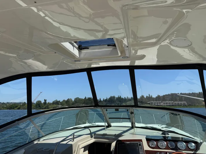  Yacht Photos Pics Interior view of 2012 Sea Ray 370 Sundancer boat with scenic water backdrop.