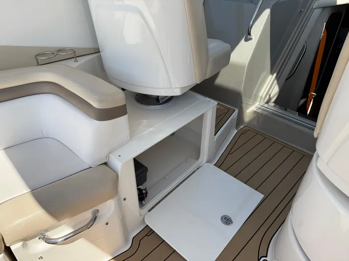  Yacht Photos Pics Interior of 2012 Sea Ray 370 Sundancer with open storage compartment and seating.