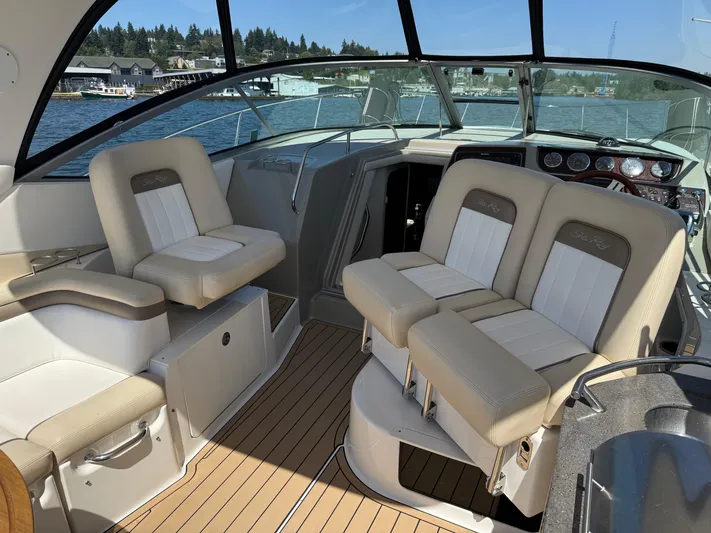  Yacht Photos Pics Interior of 2012 Sea Ray 370 Sundancer boat with beige seating and wood flooring.