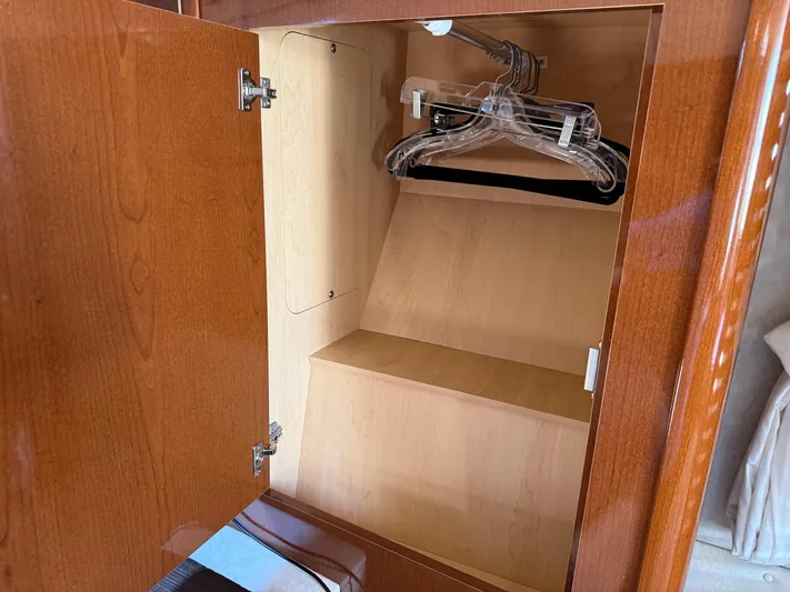  Yacht Photos Pics Wooden cabinet with hangers inside a 2012 Sea Ray 370 Sundancer yacht.