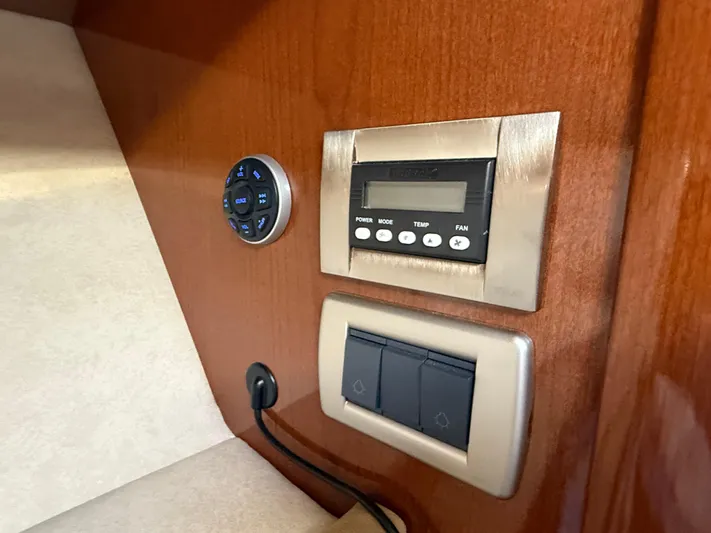  Yacht Photos Pics Control panel on 2012 Sea Ray 370 Sundancer boat, featuring temperature and fan settings.