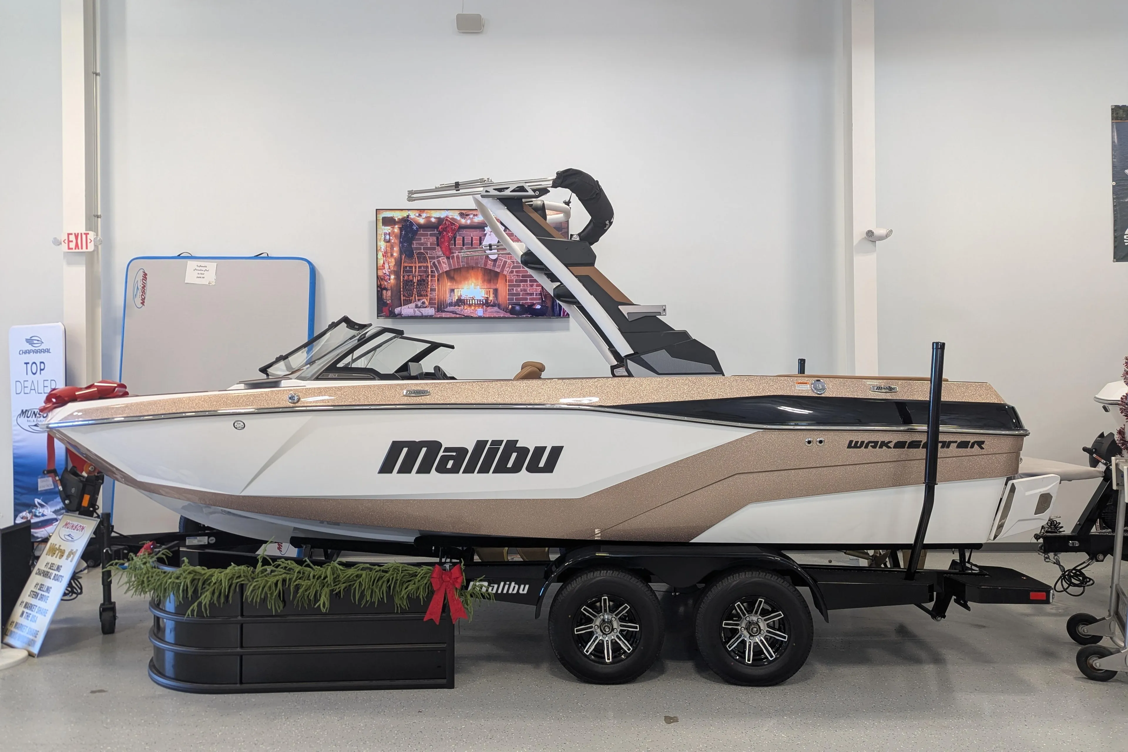 2026 Malibu Wakesetter 21 LX boat displayed indoors on a trailer.