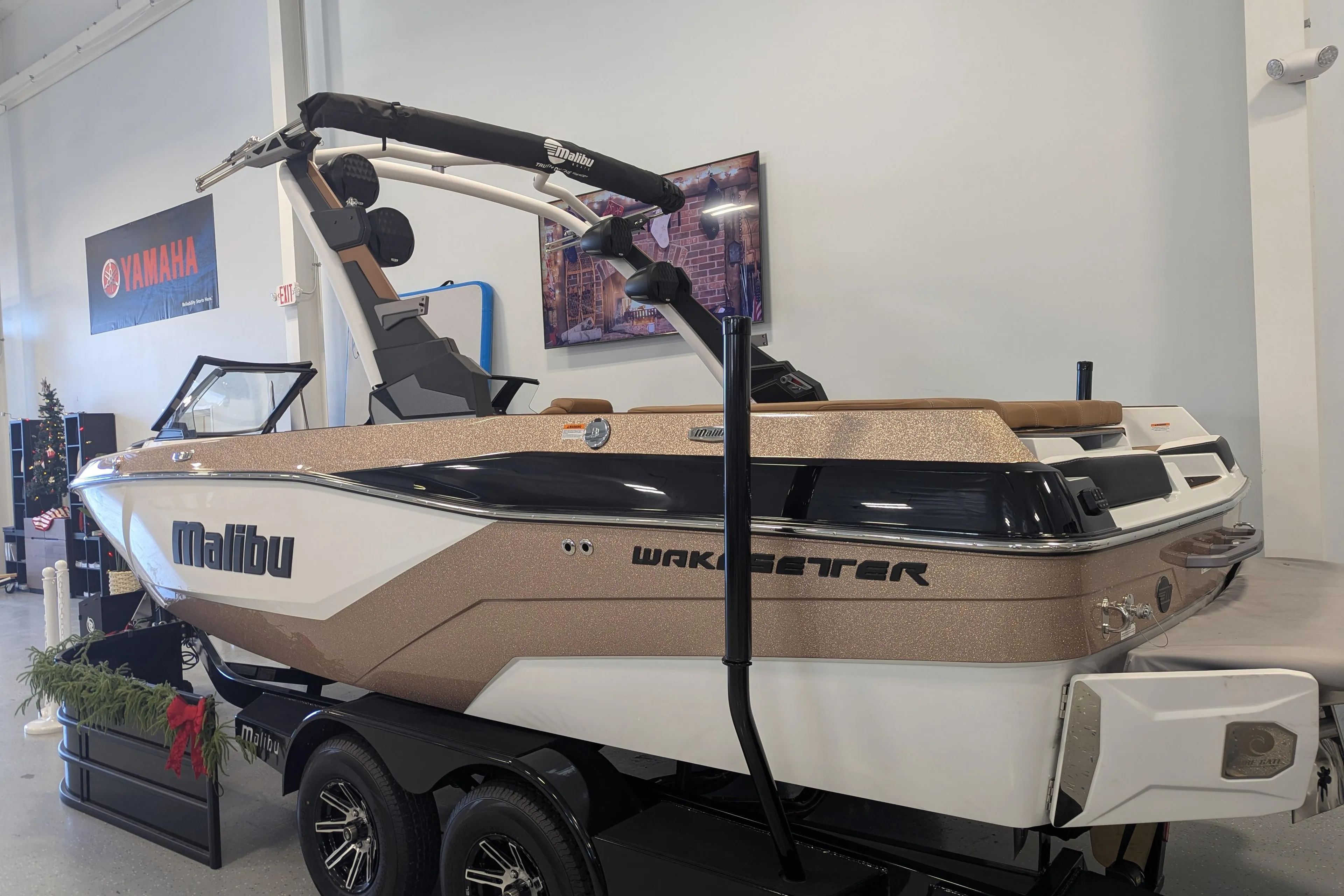 2026 Malibu Wakesetter 21 LX boat displayed indoors, featuring sleek design and modern features.