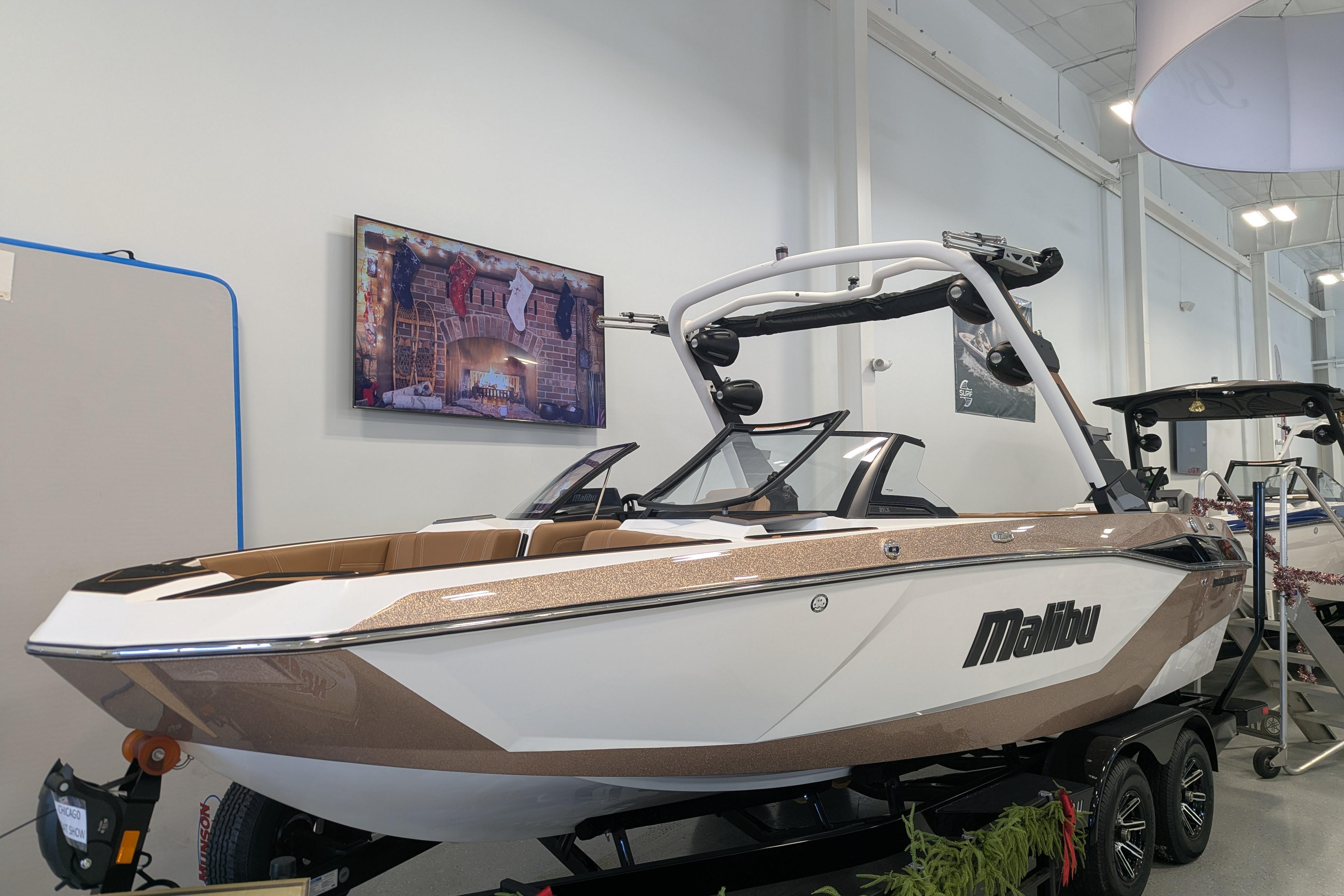 2026 Malibu Wakesetter 21 LX boat displayed indoors on a trailer.