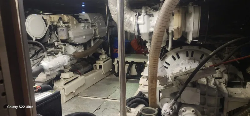 Orly Yacht Photos Pics Engine room of a 1990 President 465 yacht, showcasing mechanical components and systems.