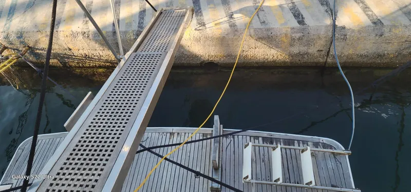 Orly Yacht Photos Pics Docked boat with gangway, President 465 model, 1990, at a marina.