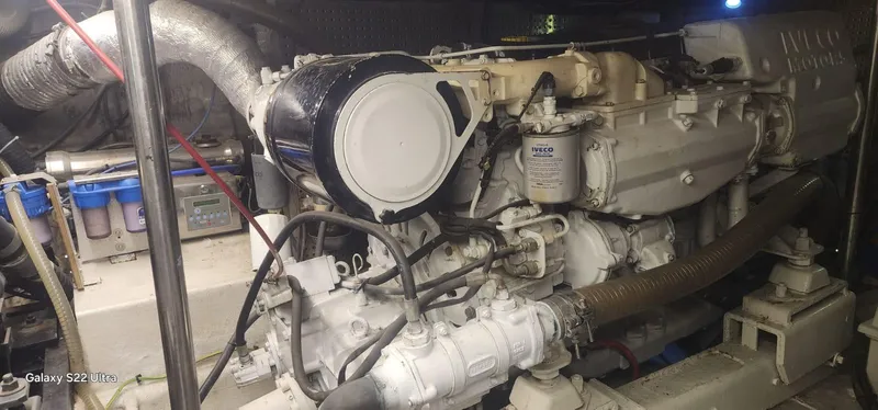 Orly Yacht Photos Pics Engine room with Iveco motor, President 465 model, 1990, featuring various mechanical components.