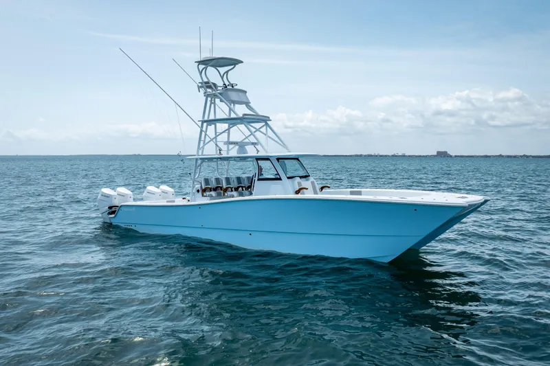 Cya Yacht Photos Pics 2025 Freeman 43 boat on open water, featuring sleek design and multiple outboard engines.